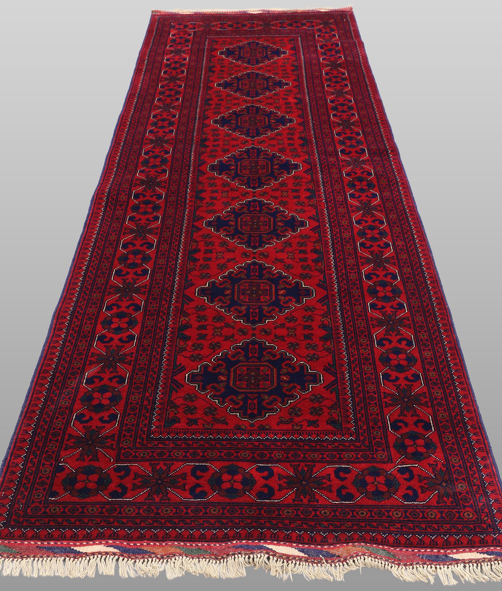 A Afghan runner carpet, 280 x 92 cm.