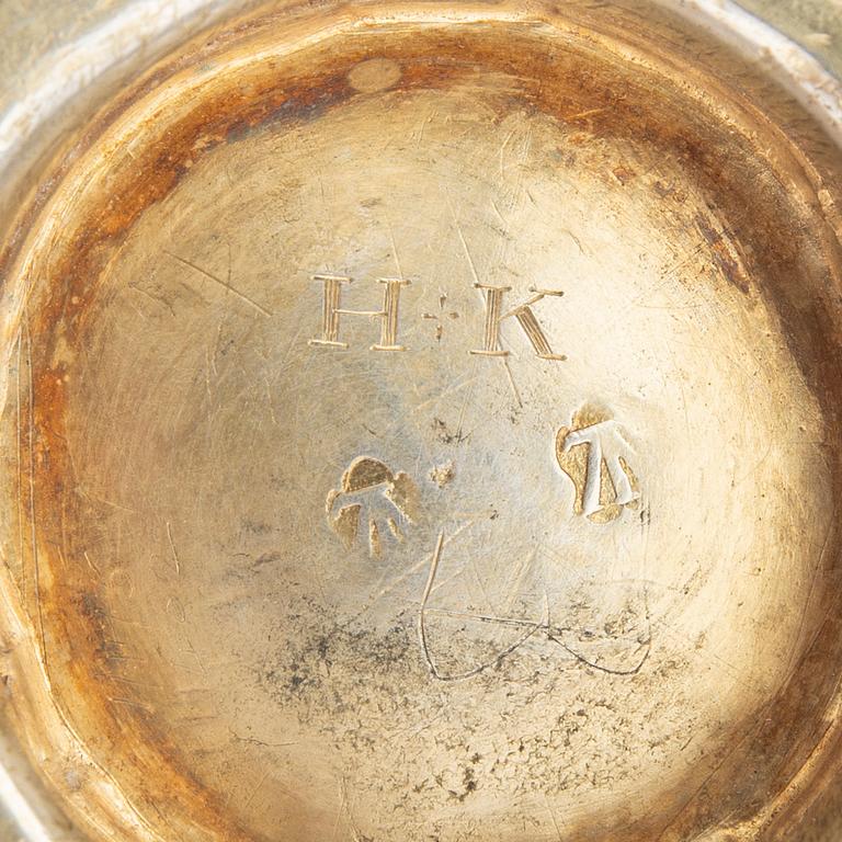 A silver guilt bowl with handles.