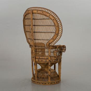 AN RATTAN ARMCHAIR.