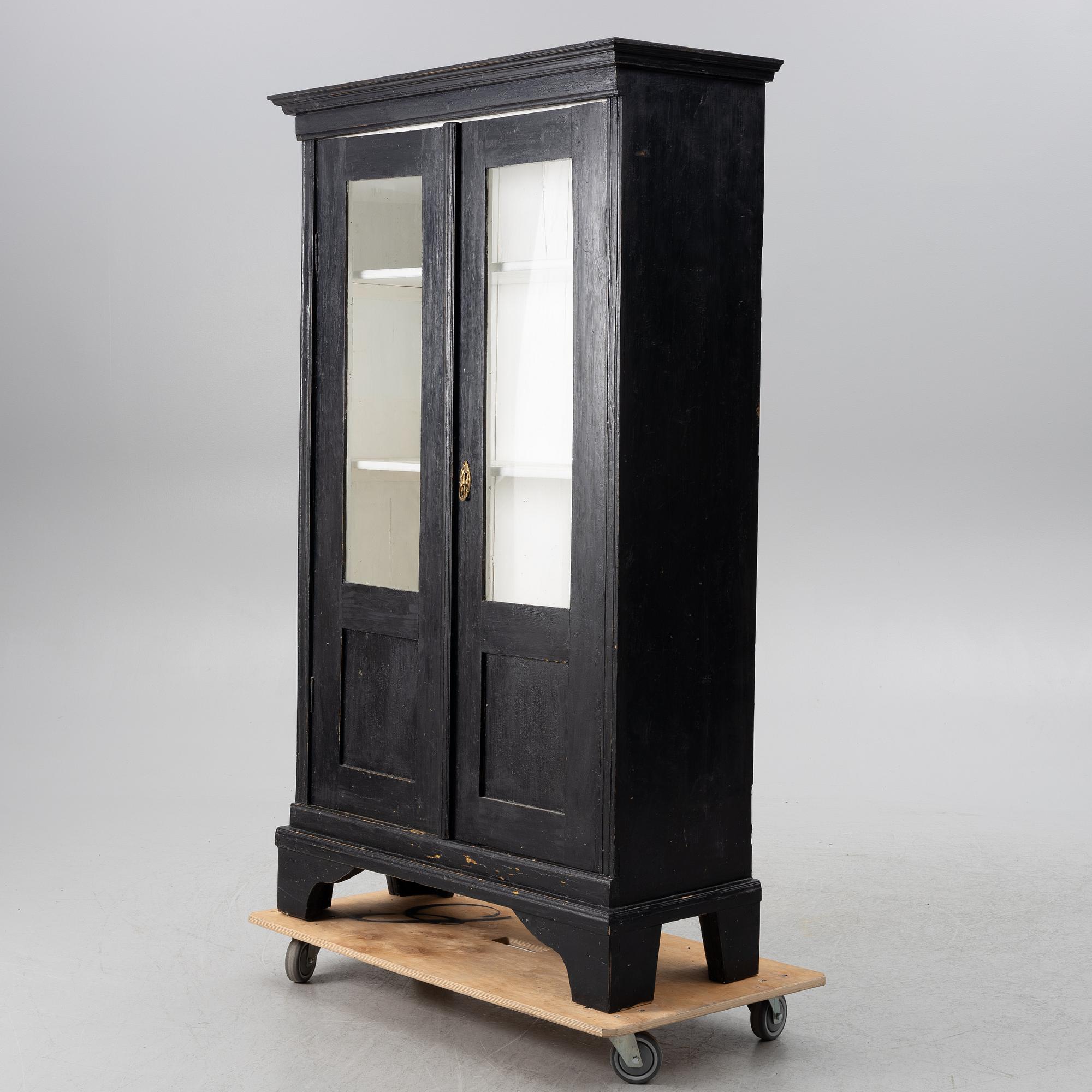 Display cabinet, circa 1900.