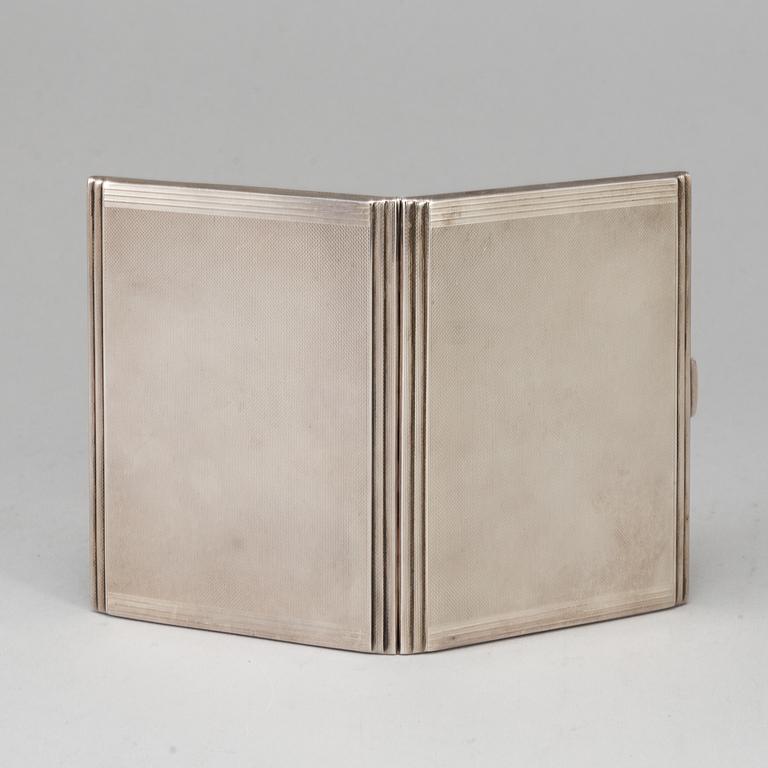 A sterling silver cigarette-case, made in 1935 by Dingley (or Davies) Brothers, Birmingham, England.