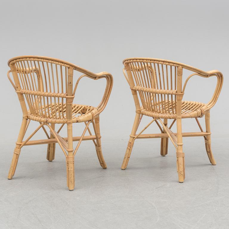 A pair of second half of the 20th century rattan easy chairs.