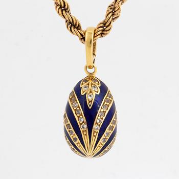 Egg pendant, gold, enamel with stones, with goldchain.