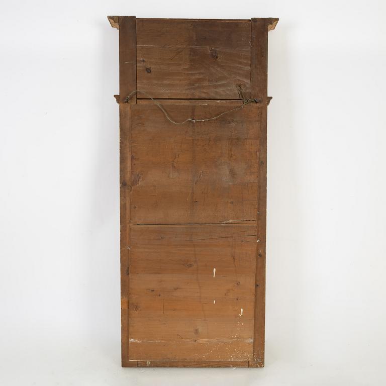 An Empire mirror, first half of the 19th Century.