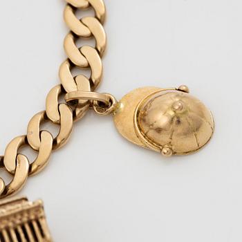 Bracelet 18K gold with charms.