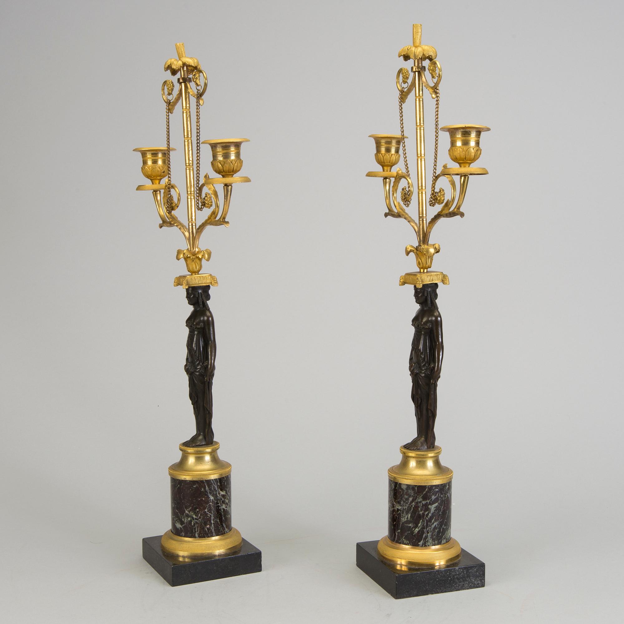 A pair of 1800s empire candelabras.