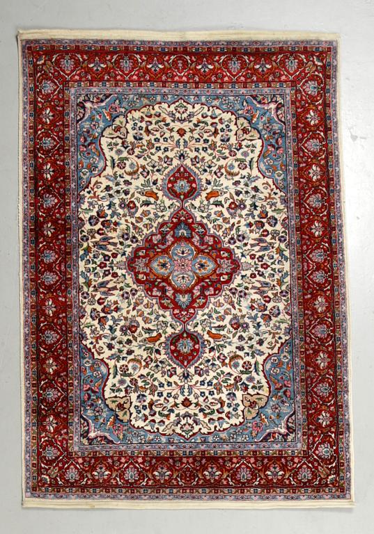 A rug, an Old Oriental,  ca 187,5 x 127 cm.