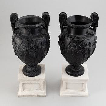 A pair of basalt ware volute vases, 19th century.