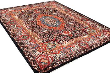 A Kashmir carpet, a. 390 x 305 cm.