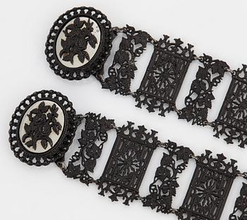 A Berlin steel and iron parure comprising a necklace, two bracelets and a brooch.