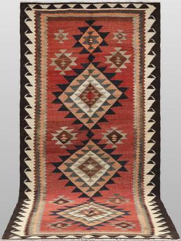 A Nomad Kurdish kilim rug, 270 x 132 cm.