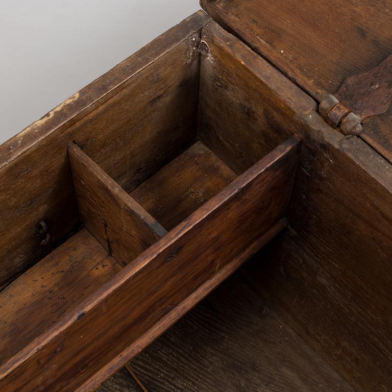 A large 17/17th century baroque oak chest with wrought iron fittings.