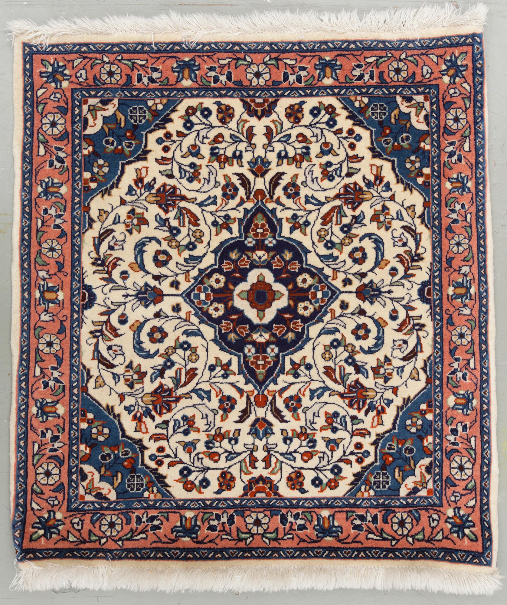 An old rug from Sarouk. Around 76 x 68 cm.