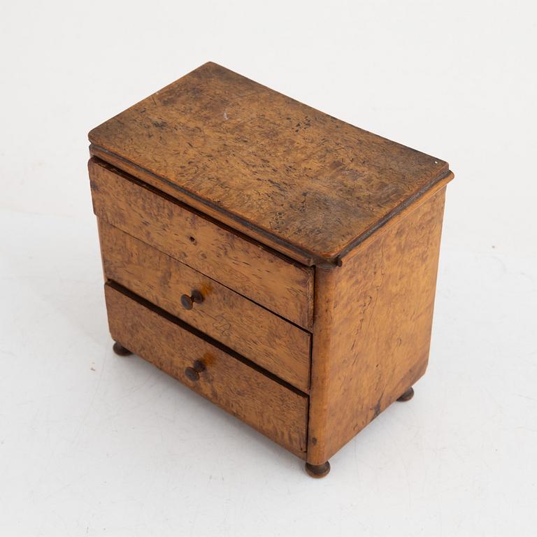 A Swedish miniature commode, 19th century.
