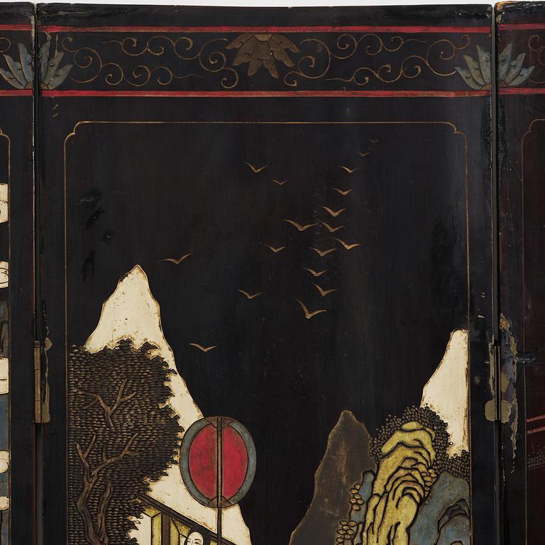 A Chinese four panel lacquer folding screen, first part of the 20th century.