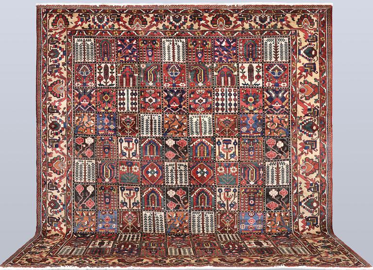 A semi-antique Baktiari carpet, approx. 360 x 308 cm.