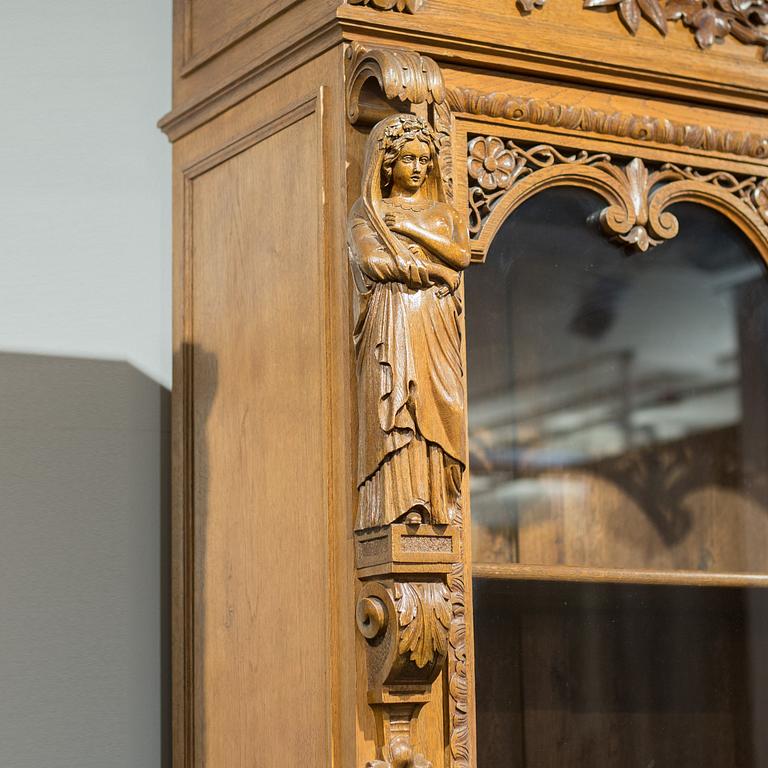 a oak vitrine cabinet from the late 1800's.