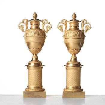 A pair of French Empire candlesticks, early 19th century.