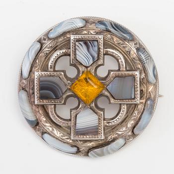 A BROOCH set with agate and paste.