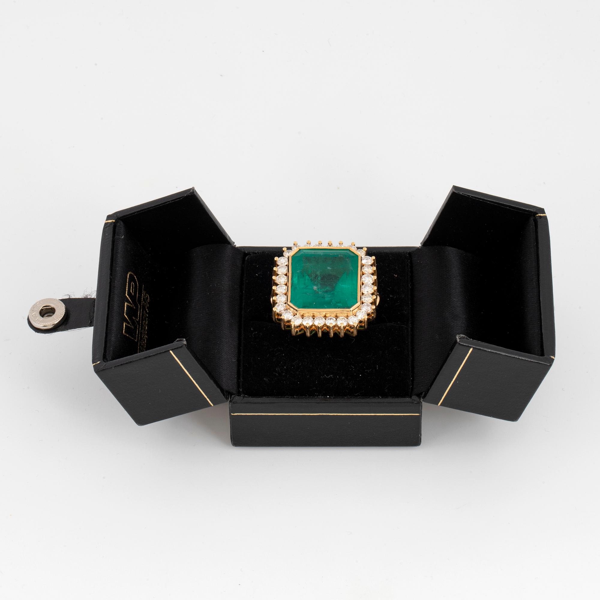 Large emerald-cut emerald and brilliant-cut diamond cocktail ring.