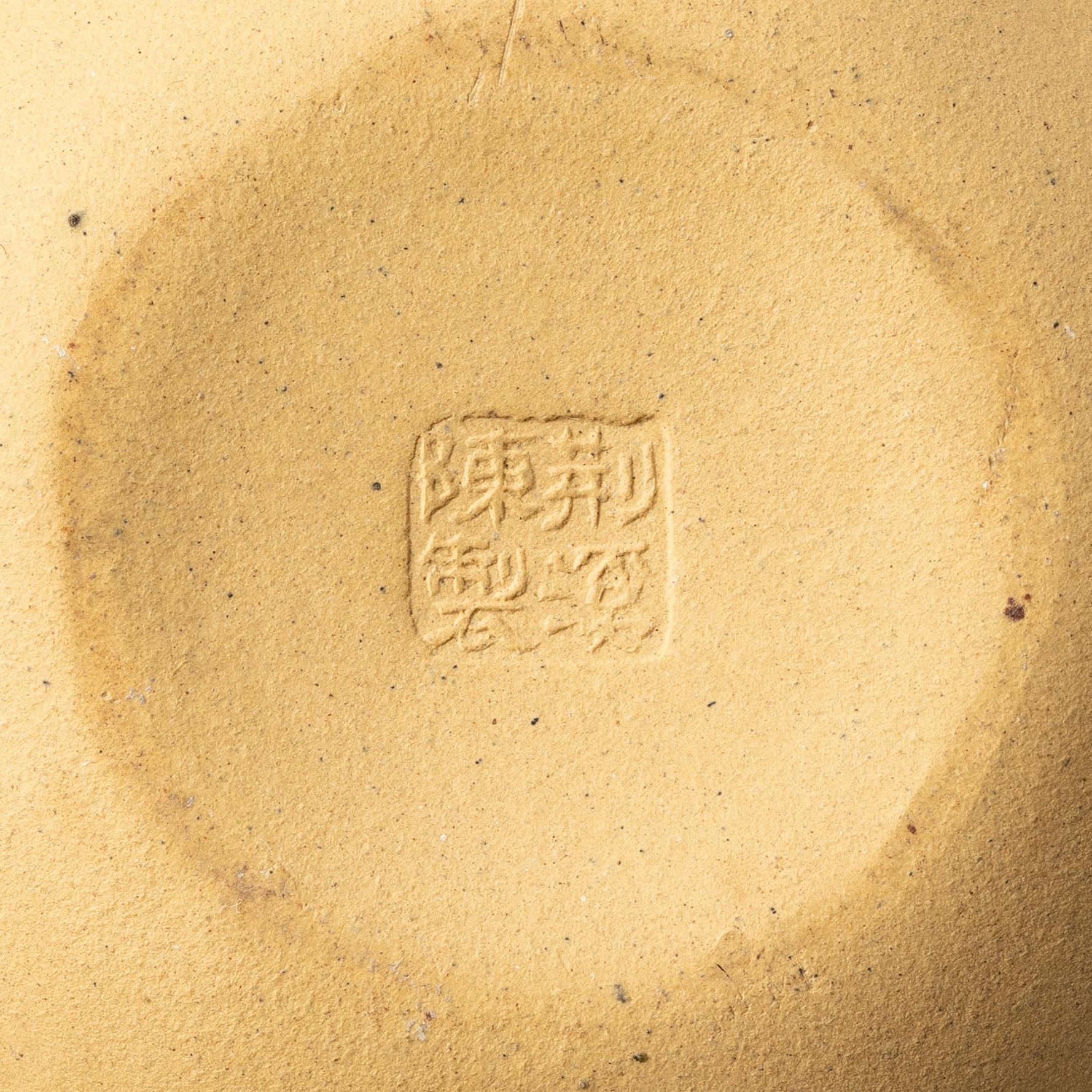 A group of three yixing teapots and a box with cover, China, 1970/80s.