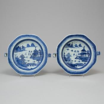 A set of two similar Chinese Qing dynasty 19th century blue and white export porcelain hot plates.