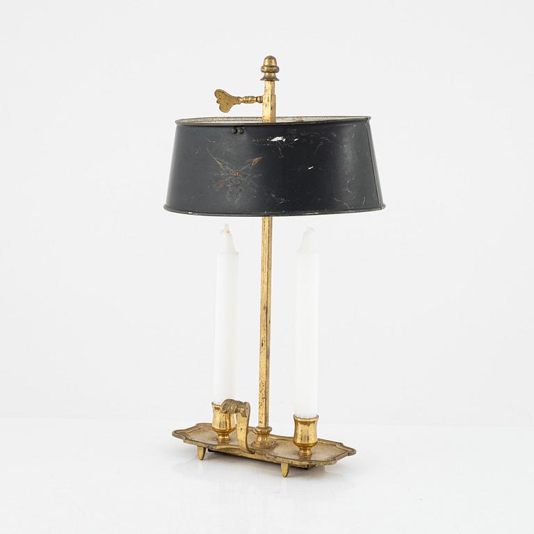 A gilt brass candlestick, 20th Century with older parts.