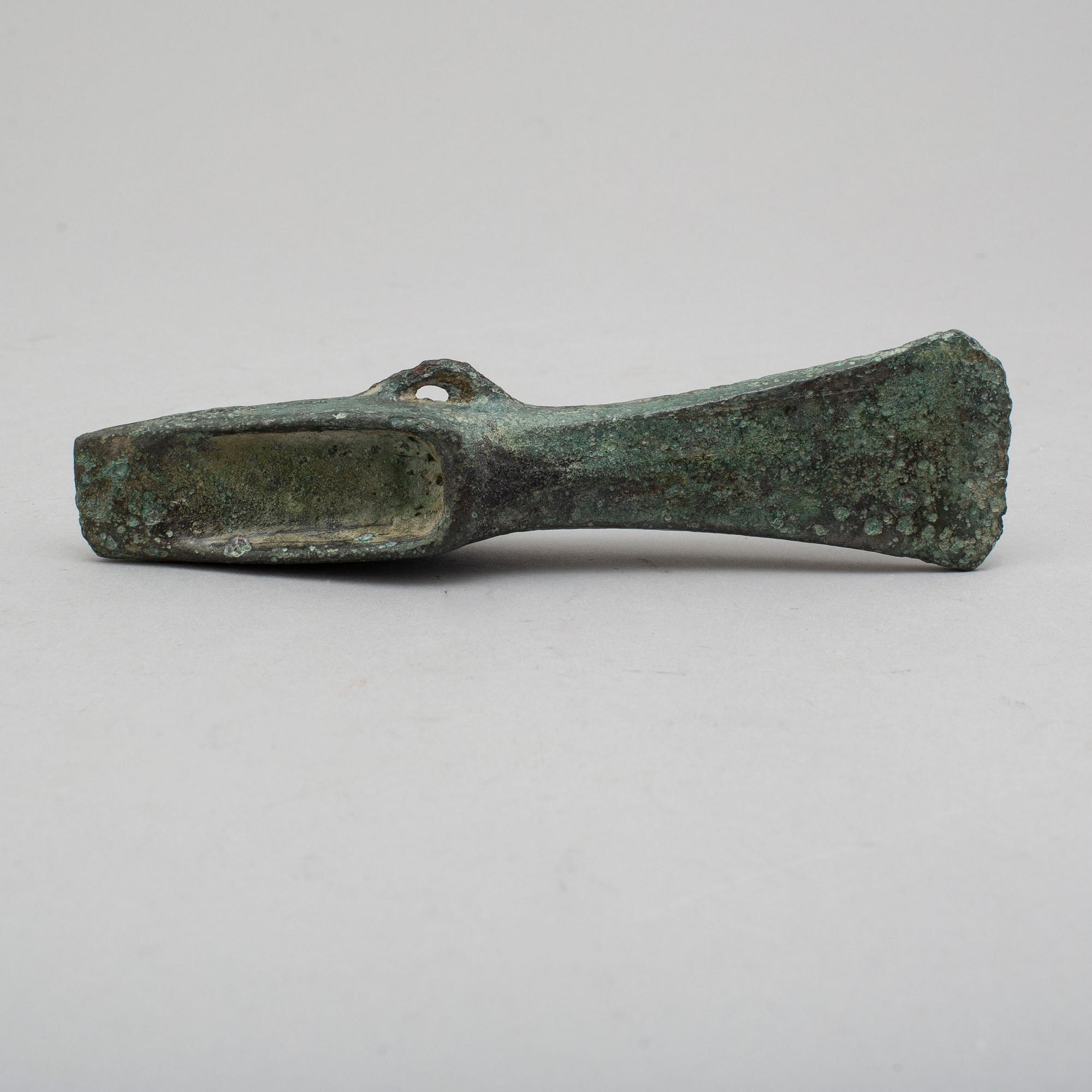 A bronze axe, 1500-500 B.C.