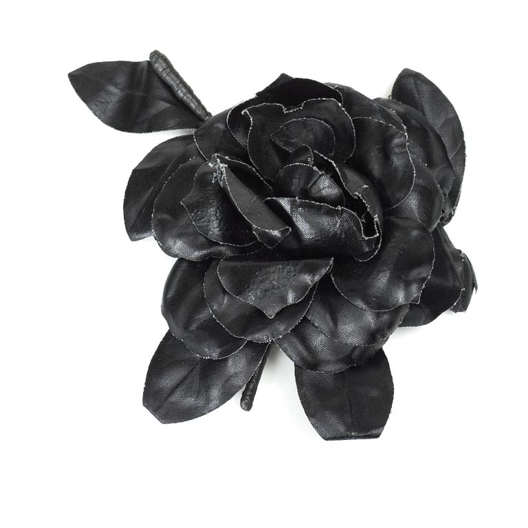 YVES SAINT LAURENT, a black brooch.