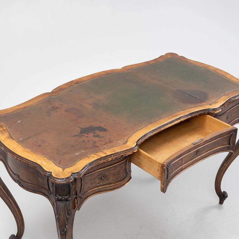 A rococo-style writing desk from the first half of the 20th century.