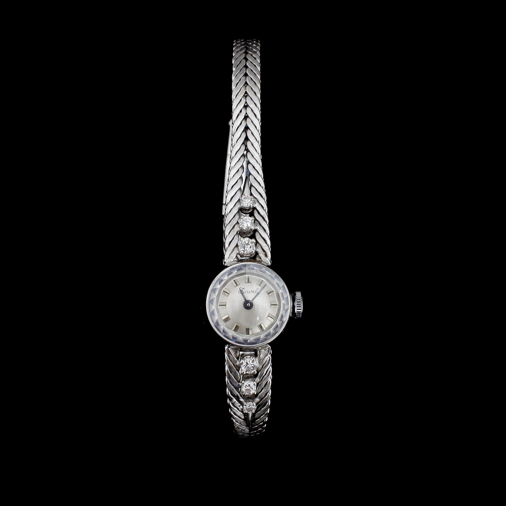 DAMARMBANDSUR, 18k vitguld med 6 briljantslipade dia, Juwel. 1970-tal. Tot.vikt 23g.