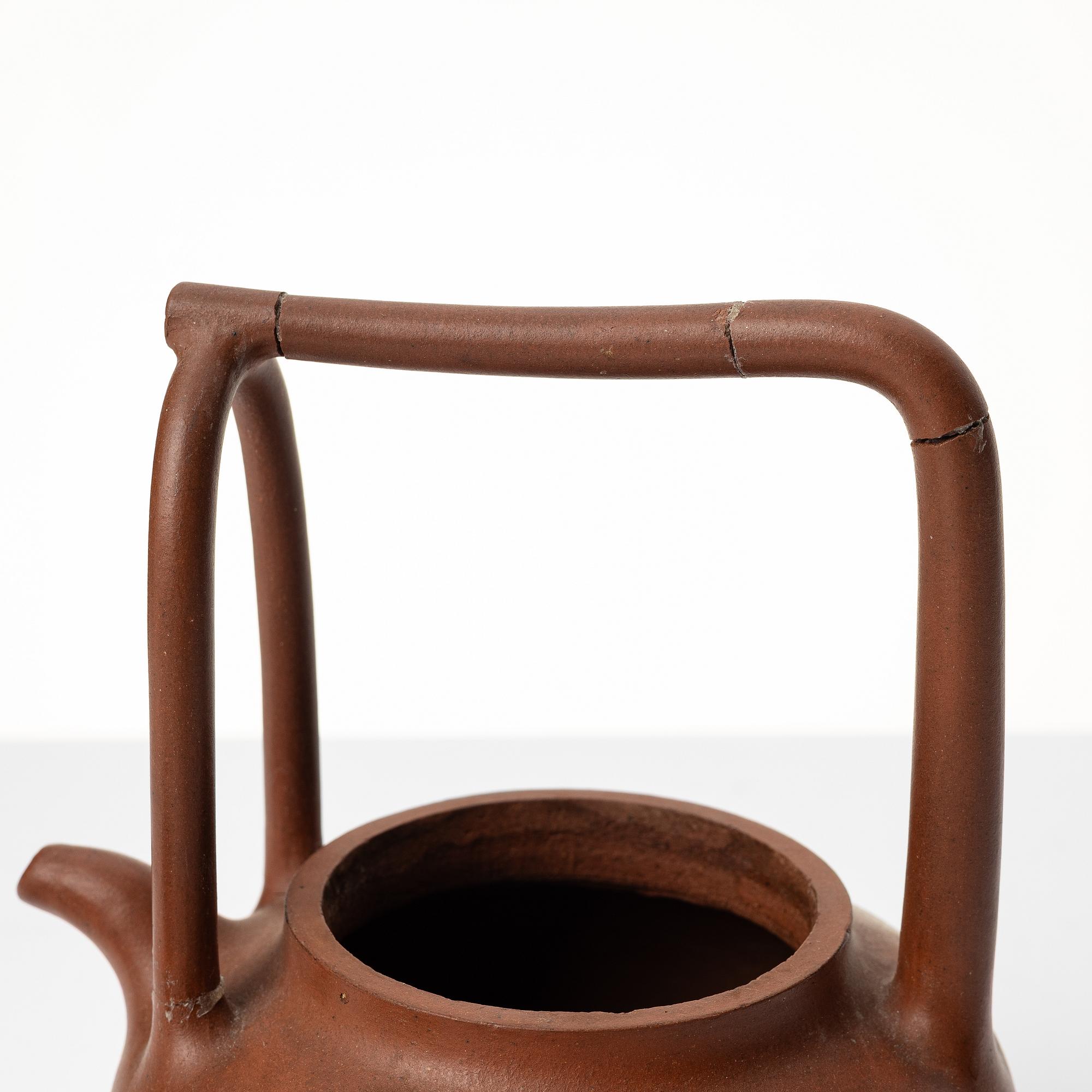 Two Chinese yixing teapots, early 1900s and 1980s.