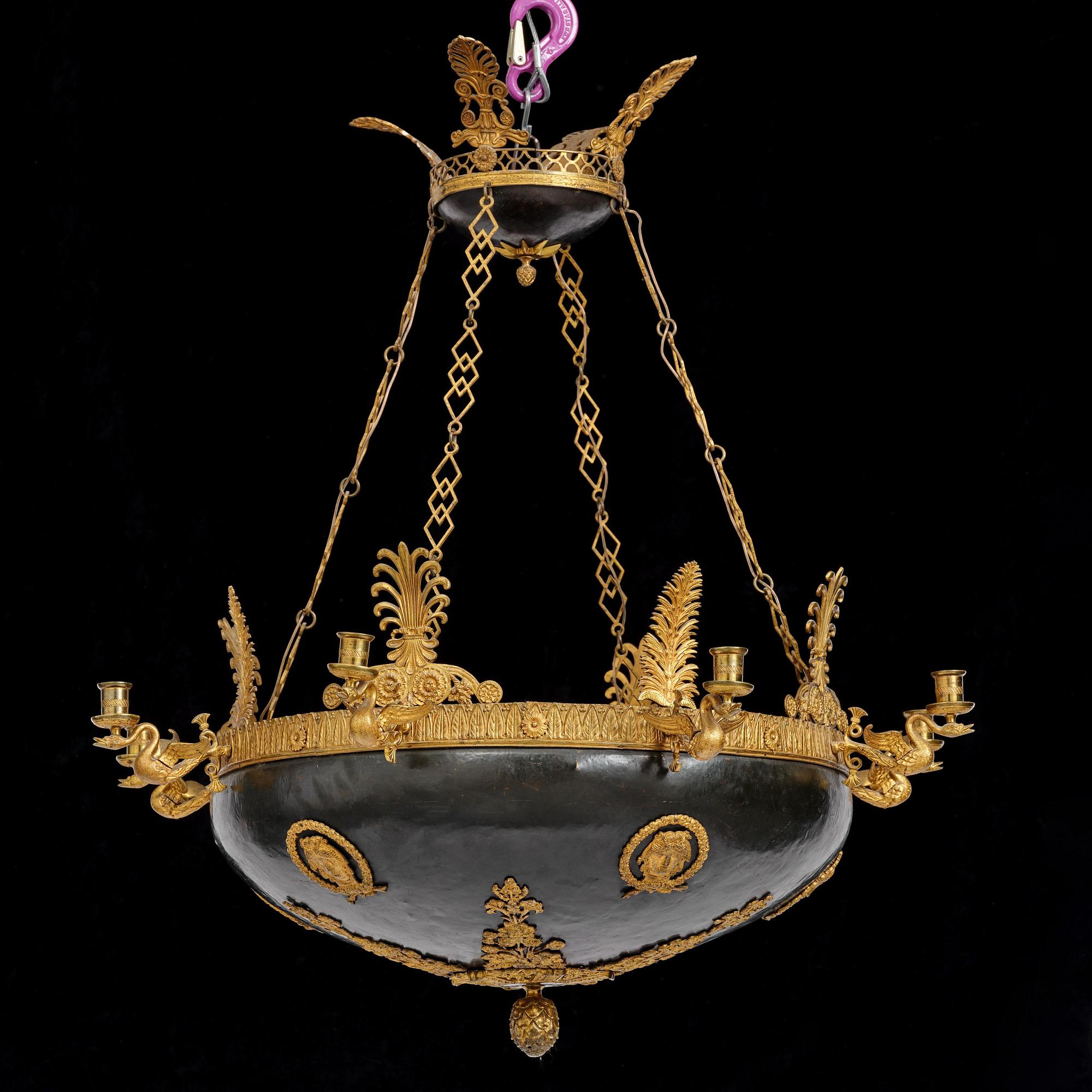 A presumably Russian Empire gilt and patinated bronze nine-branch chandelier, 19th century.