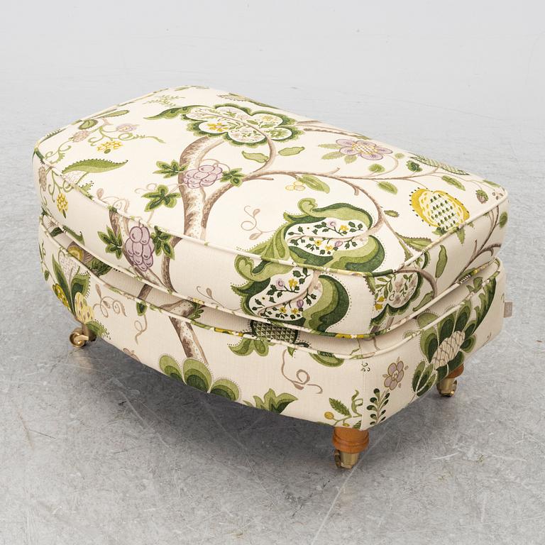 A 'Howard' armchair with footstool, Englesson.