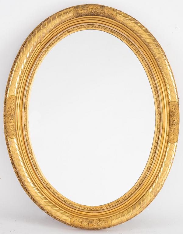 An oval mirror from around the year 1900.