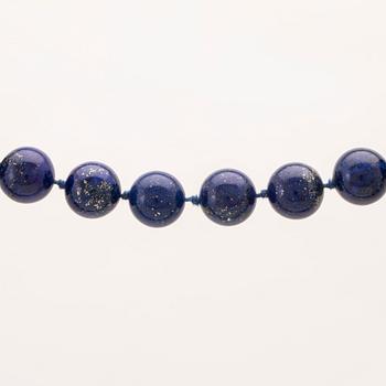 A collier of lapis lazuli and lock of partially gilded silver.