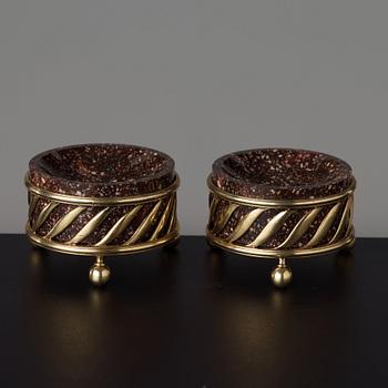 A pair of gilt silver and porphyry salts, by Gustaf Folcker, Stockholm 1827.