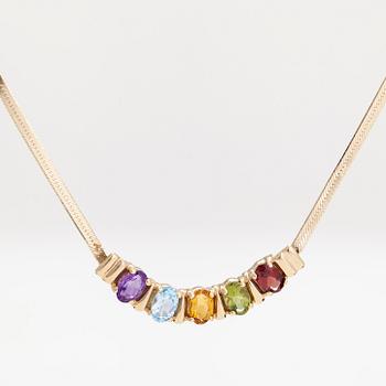 A 14K gold necklace, with multicoloured stones.