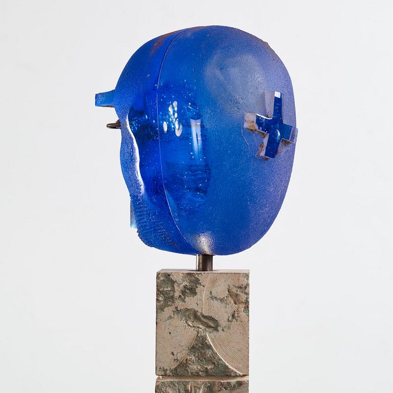 Bertil Vallien, a unique sand casted blue glass 'Head' sculpture on a hewn and polished limestone plinth, Kosta Boda, Sweden.