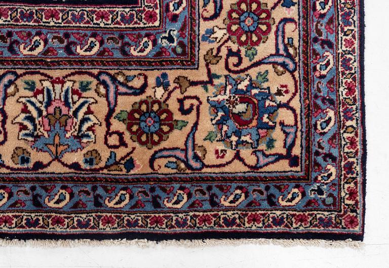 A Persian carpet, signed, c. 339 x 247 cm.