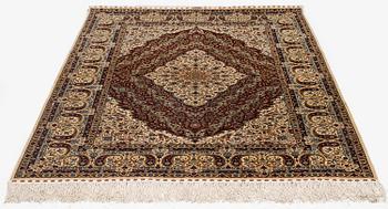 A semi-antique silk Hereke rug, West Anatolia, c. 180 x 121 cm.