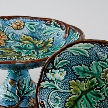 Eighteen majolica small plates and a serving dish from Rörstrand, second half of the 19th century.