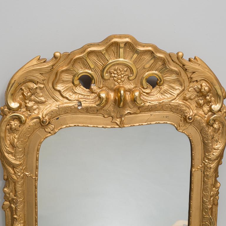 A rococo mirror, 18th century.