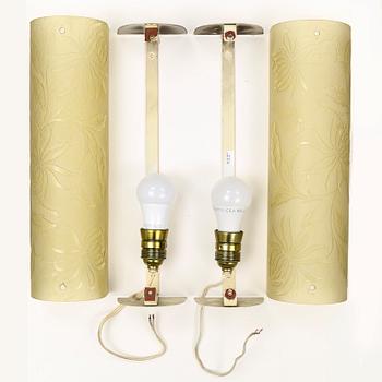 A pair of 1940s glass and metal wall lights.