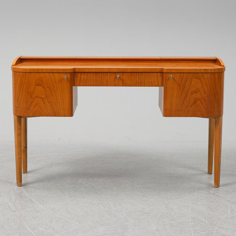 A 1940's table with pouf.