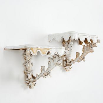 A pair of French Louis XVI-style consoles, late 19th century.