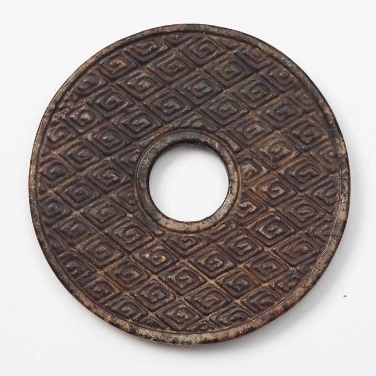 A group of three archaistic Chinese stone bi discs and two pendants.