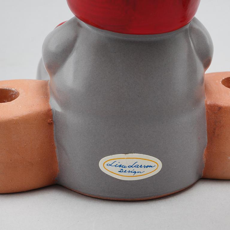 Three ceramic candlesticks by Lisa Larson for Gustavsberg, partly signed.