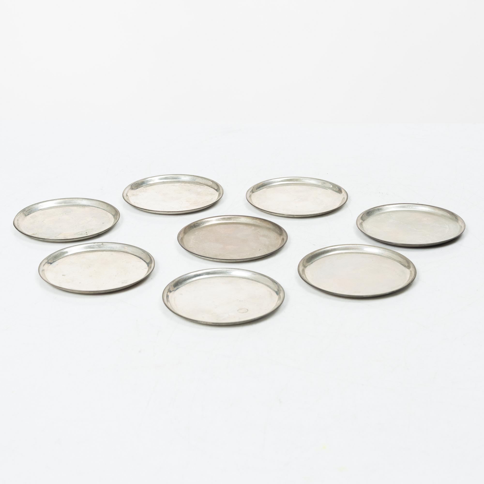 Eight coasters, silver 900, 20th century.