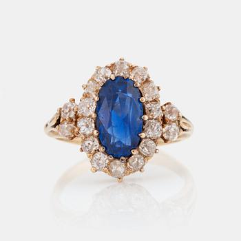 780. A RING set with a mixed-cut sapphire.